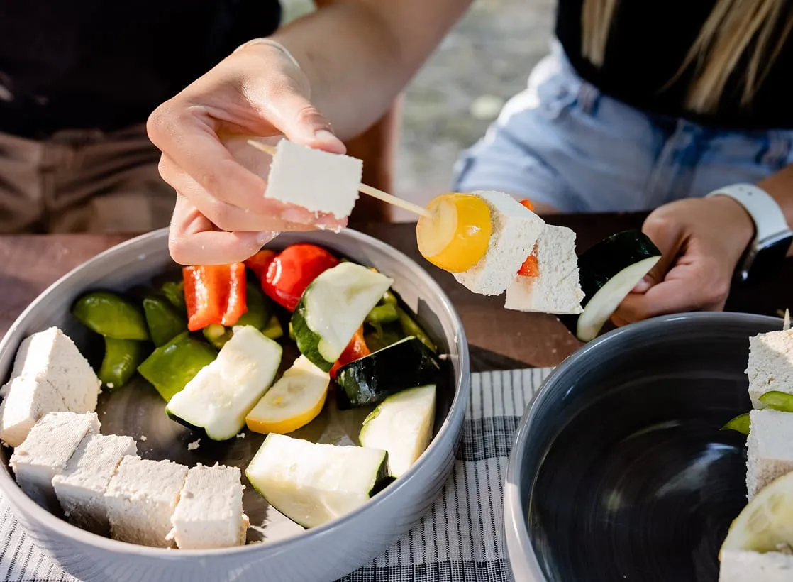 A consumer preparing a tofu based dish